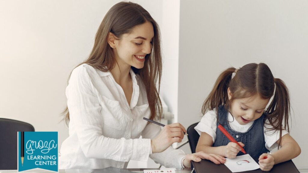 Mom guiding child in learning